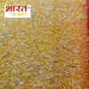 A close-up view of maize grit, a coarse texture feed made from milling corn kernels. The maize grit is golden in color and has a rough, grainy texture. It is a versatile feed that can be used for cattle, providing energy, nutrients, and fiber.